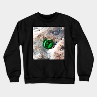 Green ball on white branches of Christmas tree Crewneck Sweatshirt